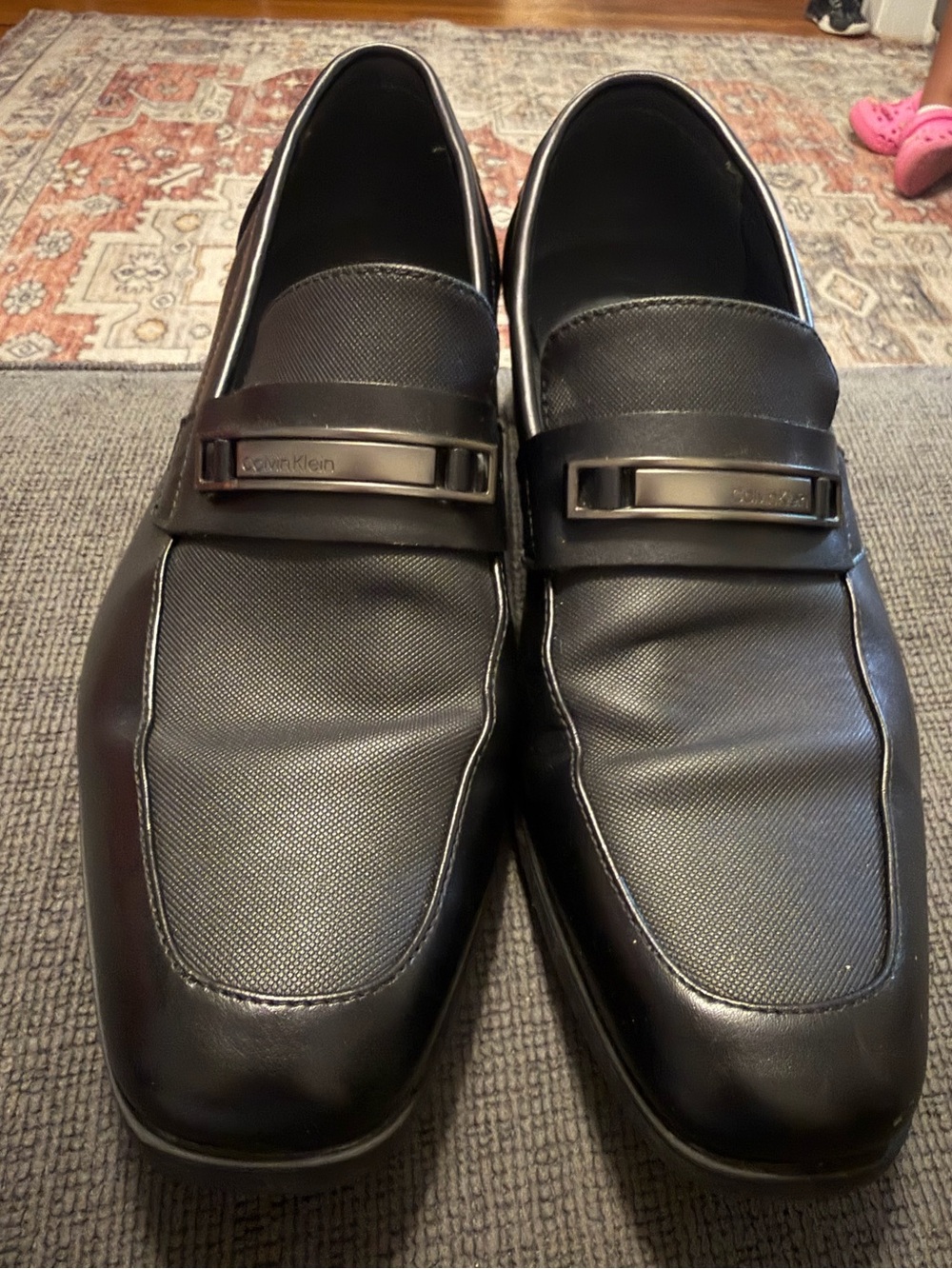 Calvin Klein Men's Black Textured Leather Slip-Ons with Metal Accent